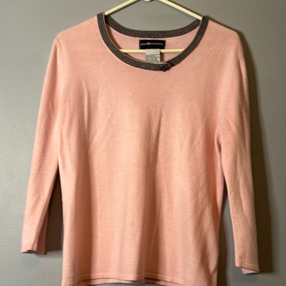 Pink sweater with detailed neck line
